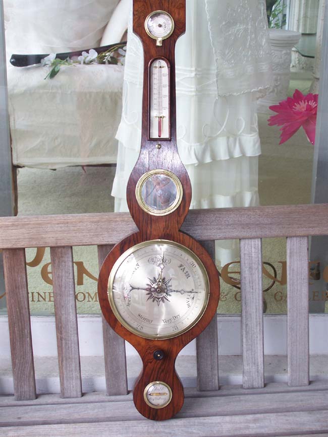 A Good mid 19th century English Rosewood Banjo form Barometer signed 'Chubb, Shaftesbury', circa 1860.